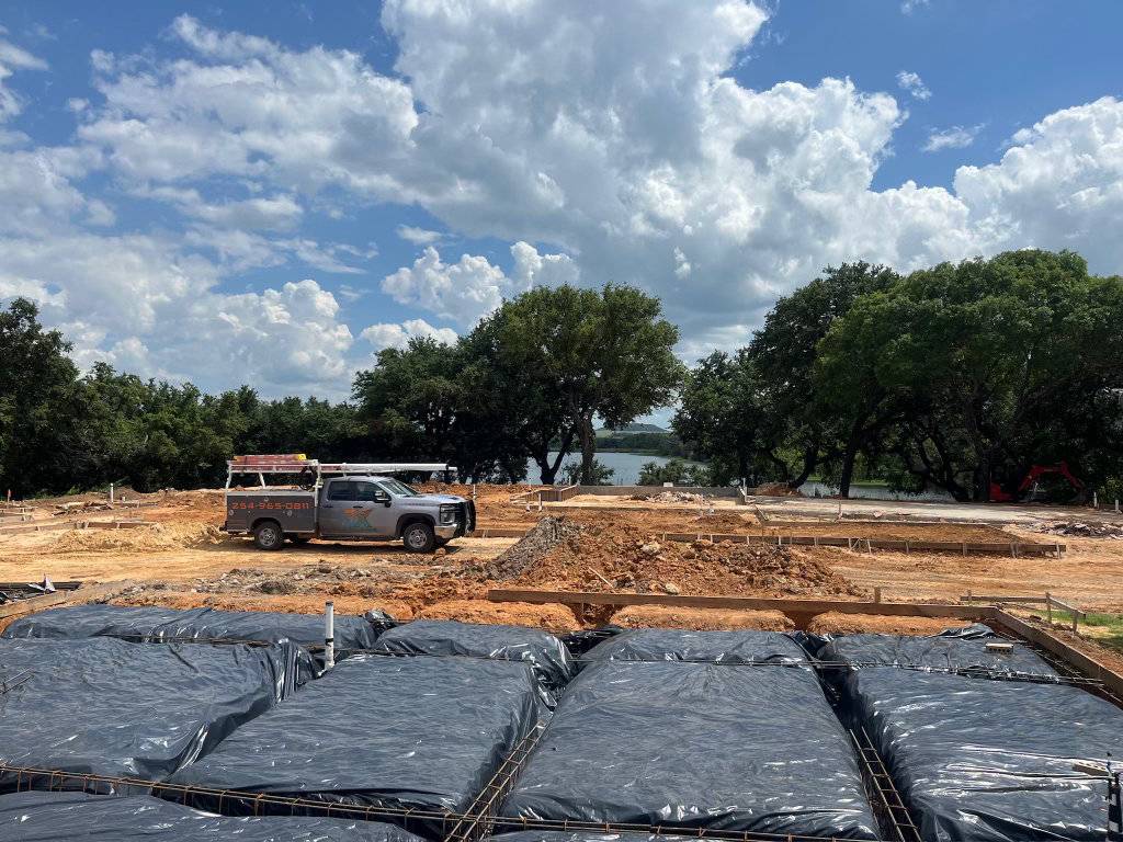 TX Plumbing Service & Repair truck and equipment trailer en route to a drain cleaning call in Stephenville, TX
