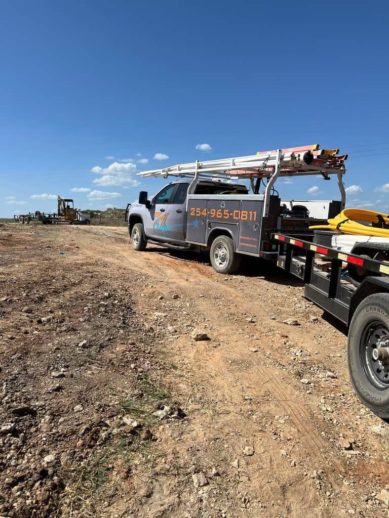 TX Plumbing Service & Repair truck at a new construction foundation site in Stephenville, TX